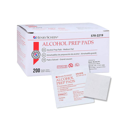 The predominantly white box and packaging of MedPharma USAs Alcohol Prep Pad (Sterile, 200 Pads/Box) feature red and black text with labels in English, Spanish, and French. An individual isopropyl alcohol pad is prominently displayed in front of the box.